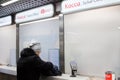 Woman is buying ticket at Cash desk at Moscow underground. Moscow, March, 08,2018.