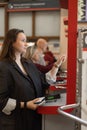 Woman Buying Train Ticket Using Vending Machine At Station Royalty Free Stock Photo