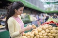 Woman buying vegetables on the market