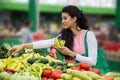 Woman buying vegetables on the market