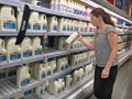 Woman Buys Australian Milk in a Supermarket Royalty Free Stock Photo