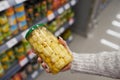 Woman buys salted mushrooms in the store