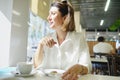 Woman in a Cafe having breakfast. Food background. Lunch time. Royalty Free Stock Photo