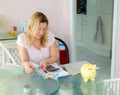 Woman calculate housekeeping allowance