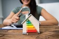 Woman Calculating Energy Efficient House Royalty Free Stock Photo