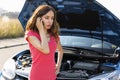 Woman caling autoservice because of car problem Royalty Free Stock Photo