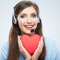 Woman call center operator hold love symbol Red heart. Close up Royalty Free Stock Photo