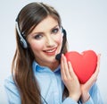 Woman call center operator hold love symbol Red heart. Close up Royalty Free Stock Photo