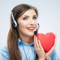 Woman call center operator hold love symbol Red heart. Close up Royalty Free Stock Photo