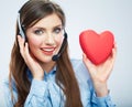 Woman call center operator hold love symbol Red heart. Close up Royalty Free Stock Photo