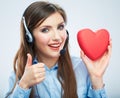 Woman call center operator hold love symbol Red heart. Close up Royalty Free Stock Photo