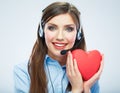 Woman call center operator hold love symbol Red heart. Close up Royalty Free Stock Photo