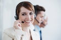 Woman, callcenter and phone call, communication and contact us with headset and mic, coworking and smile. Telecom Royalty Free Stock Photo