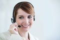 Woman, callcenter and phone call with headset and mic, CRM or contact us with smile for communication. Telecom, customer Royalty Free Stock Photo