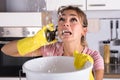 Woman Calling Plumber To Fix Water Leaking From Ceiling Royalty Free Stock Photo