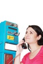 Woman calling from public phone Royalty Free Stock Photo