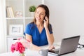 Woman calling on smartphone at office or home Royalty Free Stock Photo