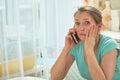 The woman calls the doctor severe toothache. terrible news on the phone. Royalty Free Stock Photo