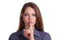 Woman calls for silence, finger on lips Royalty Free Stock Photo