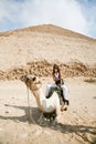 Woman camel and pyramid Royalty Free Stock Photo