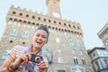 Woman with camera in front of palazzo vecchio Royalty Free Stock Photo