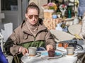 Woman with camera in outdoor cafe. Barcelona, Catalonia. Royalty Free Stock Photo