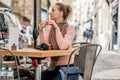 Woman with camera in outdoor cafe. Barcelona, Catalonia. Royalty Free Stock Photo