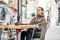 Woman with camera in outdoor cafe. Barcelona, Catalonia. Royalty Free Stock Photo