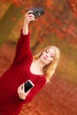 Woman with camera and smartphone take selfie photo Royalty Free Stock Photo