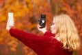 Woman with camera and smartphone take selfie photo Royalty Free Stock Photo