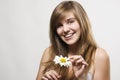 Woman with camomile Royalty Free Stock Photo