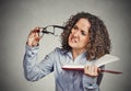 Woman can't see read book has vision problems wrong glasses Royalty Free Stock Photo