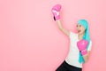 Woman cancer patient standing in pink background