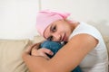 Woman with cancer sitting after chemotherapy sessions.