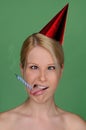 Woman with candle extinguished and festive cap Royalty Free Stock Photo