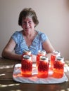 Woman with canned cherry fruit Royalty Free Stock Photo