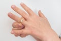 Woman cannot take off stuck wedding ring Royalty Free Stock Photo