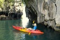 Woman in a canoe paddling