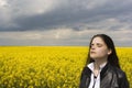 Woman on canola field Royalty Free Stock Photo