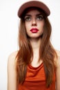 Woman with a cap Look up surprise of the model on her head red sundress Royalty Free Stock Photo