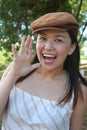 Woman with cap shouting