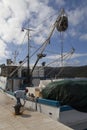 Woman captain tying fishing boat