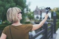 Woman capturing herself with personal camera