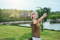 Woman capturing herself with personal camera
