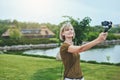 Woman capturing herself with personal camera