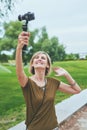 Woman capturing herself with personal camera