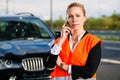 Woman with car breakdown calling towing company Royalty Free Stock Photo