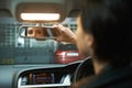 Woman, car and checking mirror in parking lot for observation, awareness or transportation. Female person or driver Royalty Free Stock Photo