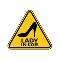 Woman car driver sticker. Female in automobile warning sign. Lady shoe with a heel in yellow triangle to vehicle glass.