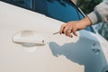 Woman with car key. Opening car door. Woman`s hand unlock a door on a car. Sunlight. Transportation Royalty Free Stock Photo